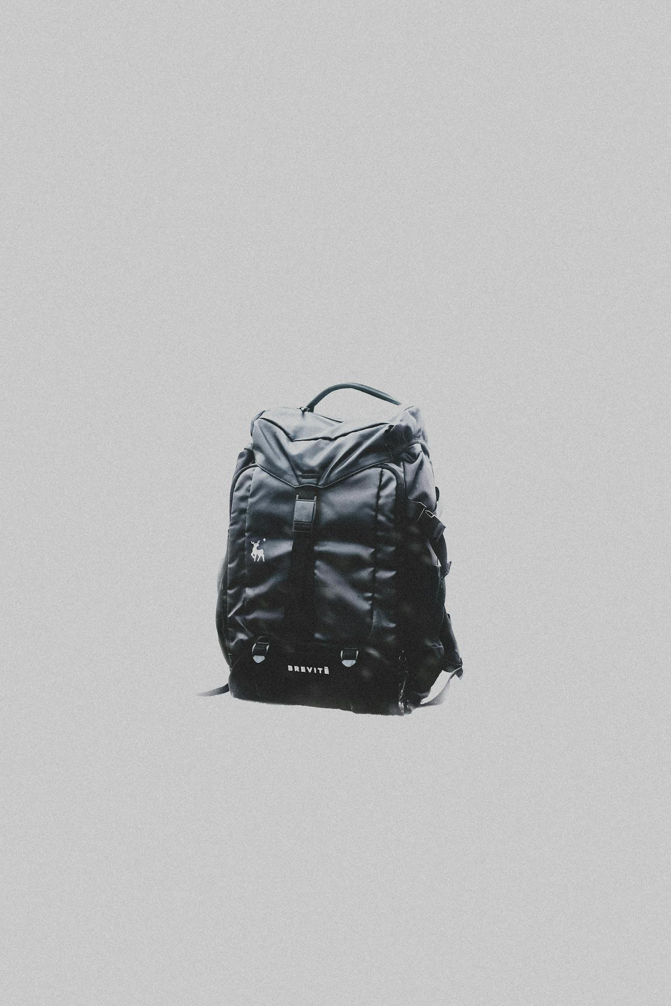 A Black Backpack on White Surface 